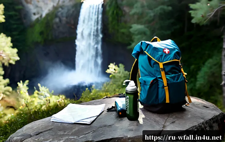 폭포 여행 시 챙겨야 할 필수 아이템 - Photorealistic waterfall travel essentials arranged neatly on a large flat rock beside a misty fores...